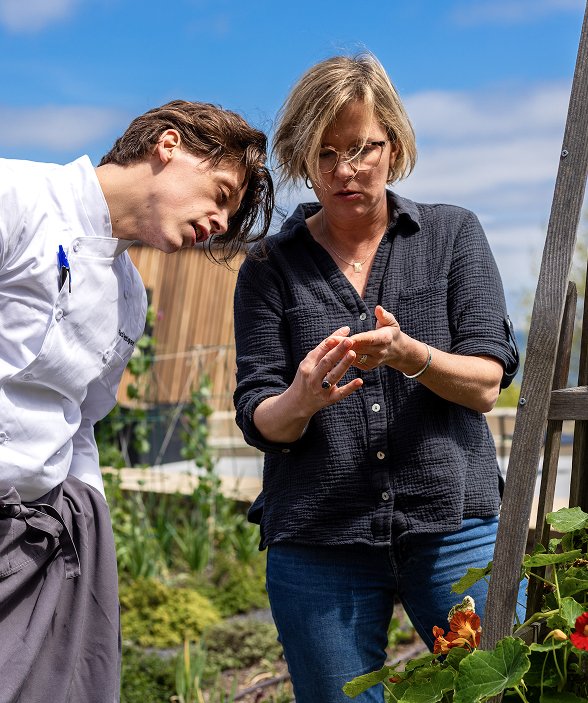 chef and farmer looking at produce