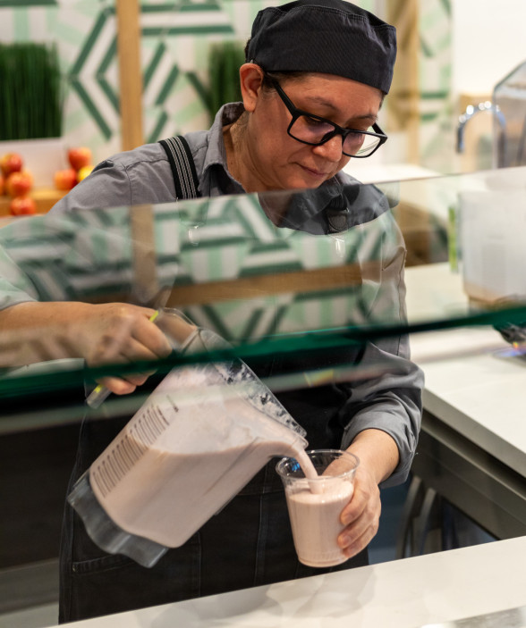 female chef pouring smoothy