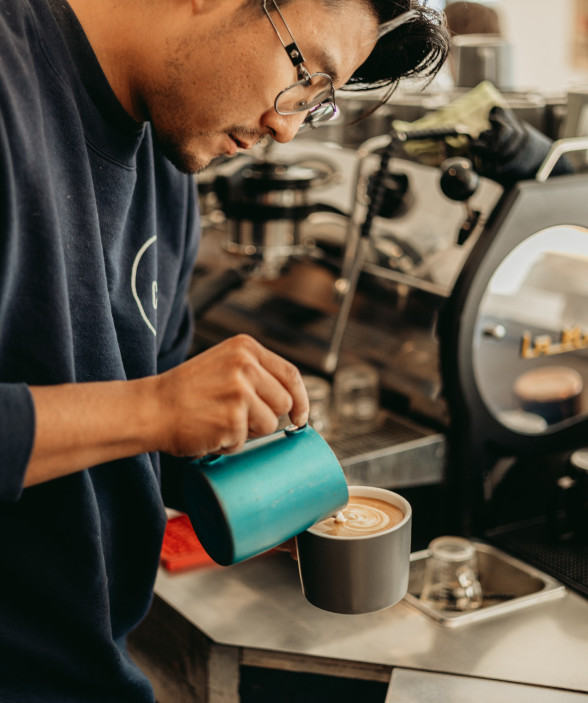 barista making coffee