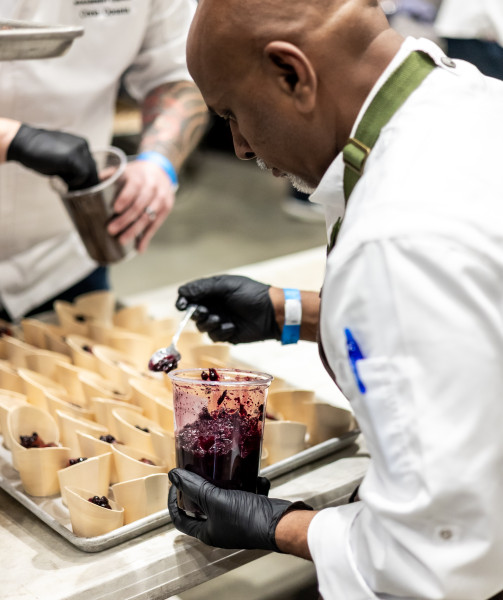 chef filling cups with jam