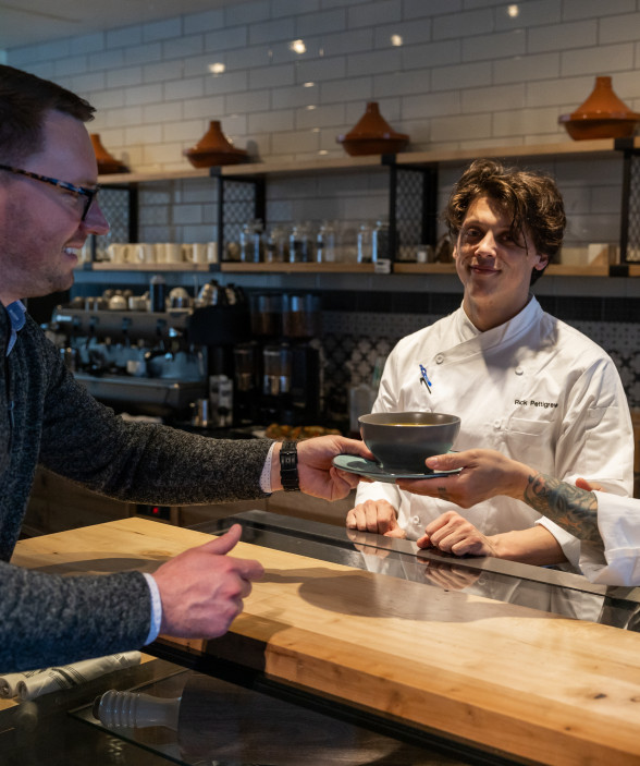 chefs serving soup