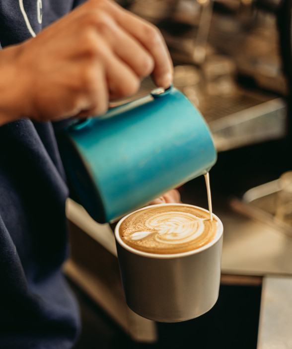 close up coffee cream design pour