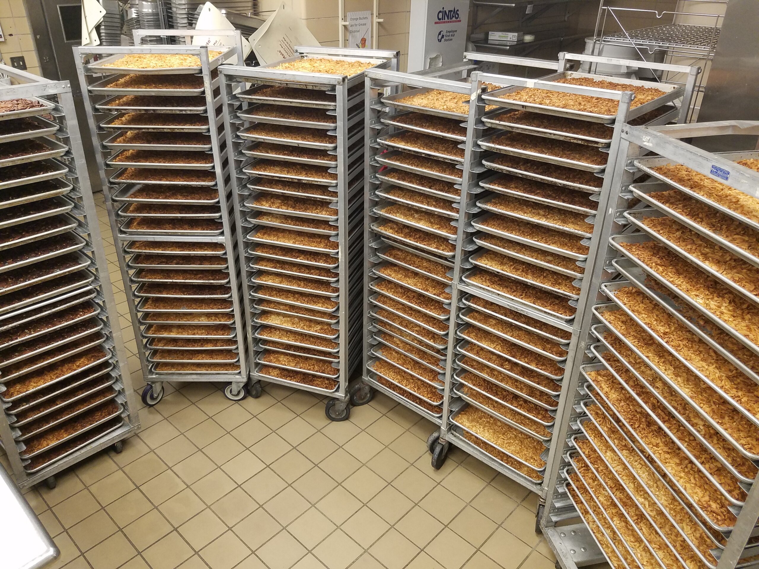 Speed racks full of toasted coconut getting ready to be added to beer