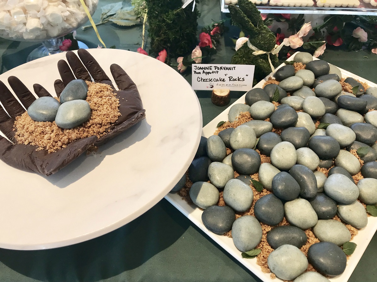 Chocolate hands cradling cheesecake "rocks"