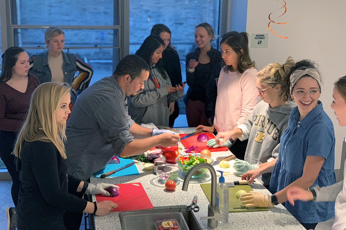 Students enjoying themselves while absorbing new skills from Catering Chef Taylor Hignite