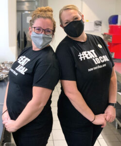 two women in Eat Local t-shirts