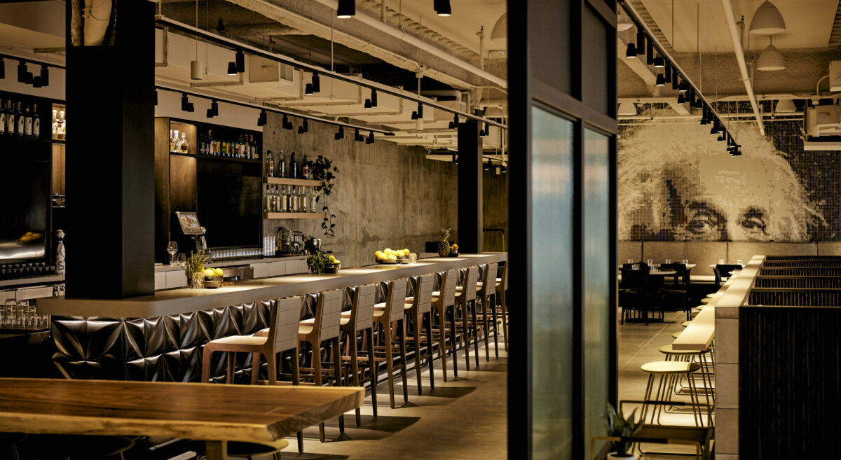 The warm interior of Chico Marx, replete with a bar and artistic image of Albert Einstein